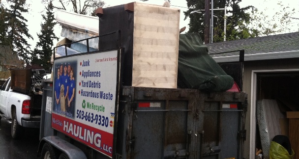 Truck loaded with junk. Apartment Clean Out Services in Vancouver WA provided by Mike & Dad's Hauling