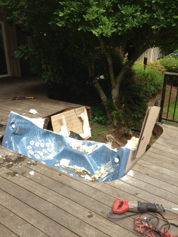 hot tub removed by cutting it in half in Mike & Dad's Hauling junk removal Vancouver Washington