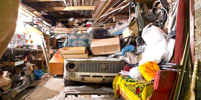 Garage full of junk. Mike & Dad's Hauling provides garage cleanout services in Vancouver WA.