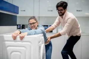 Vancouver couple tries to haul heavy washing machine out of their house on their own